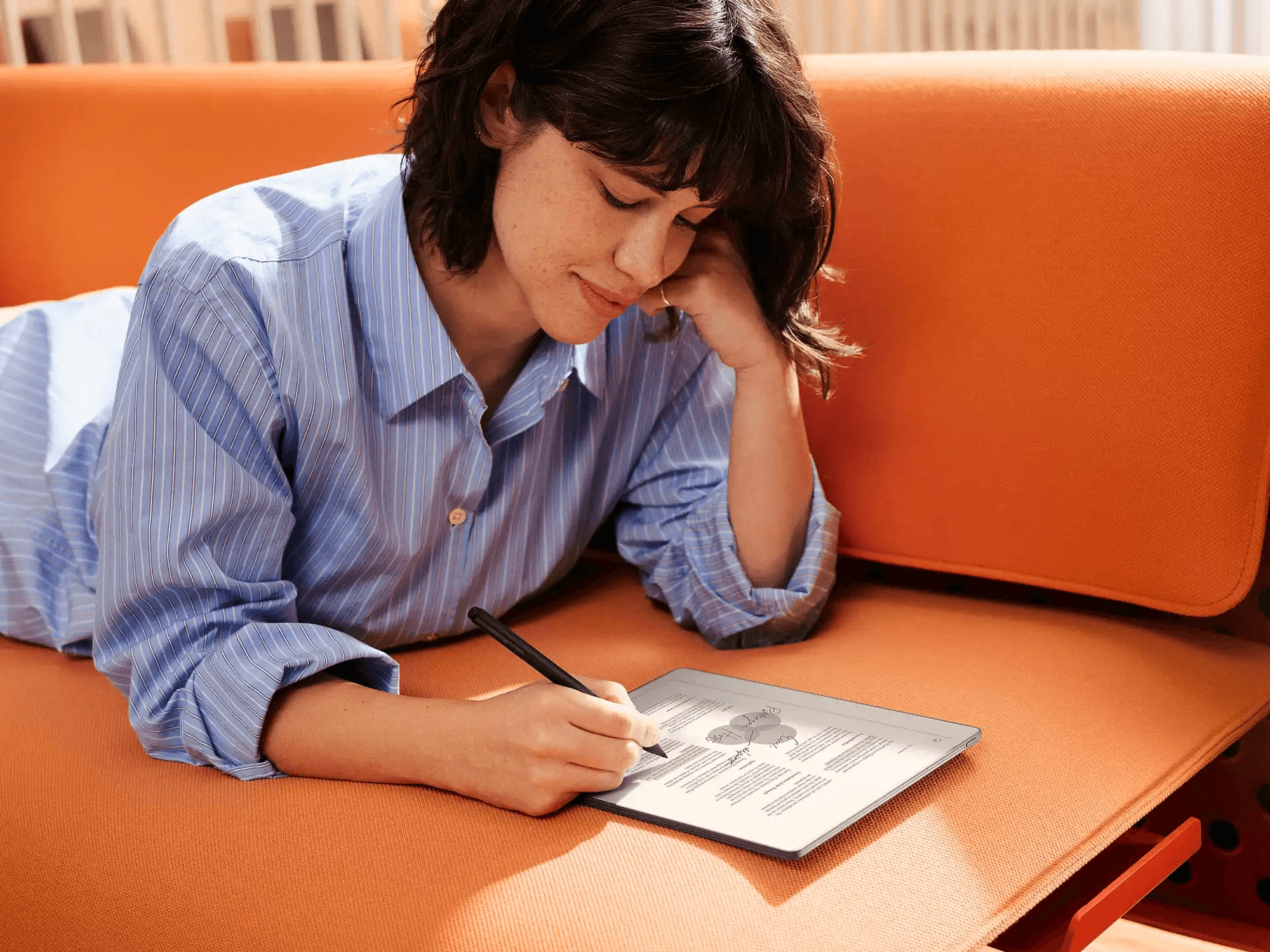 Woman taking notes on the reMarkable Paper Pure tablet