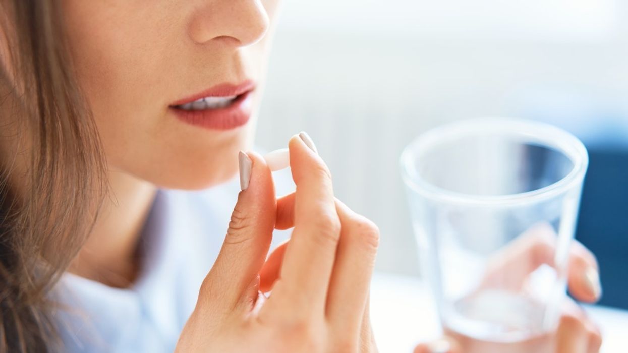 Woman taking pill