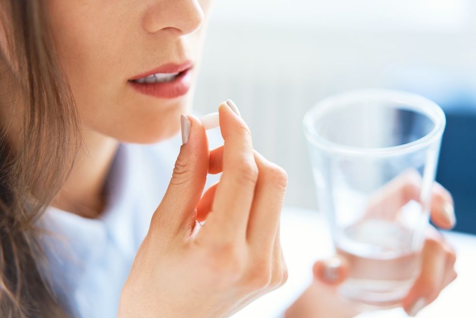 Woman taking pill