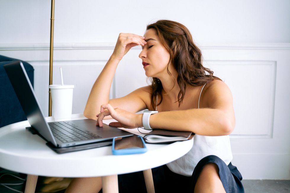 Woman tired at desk