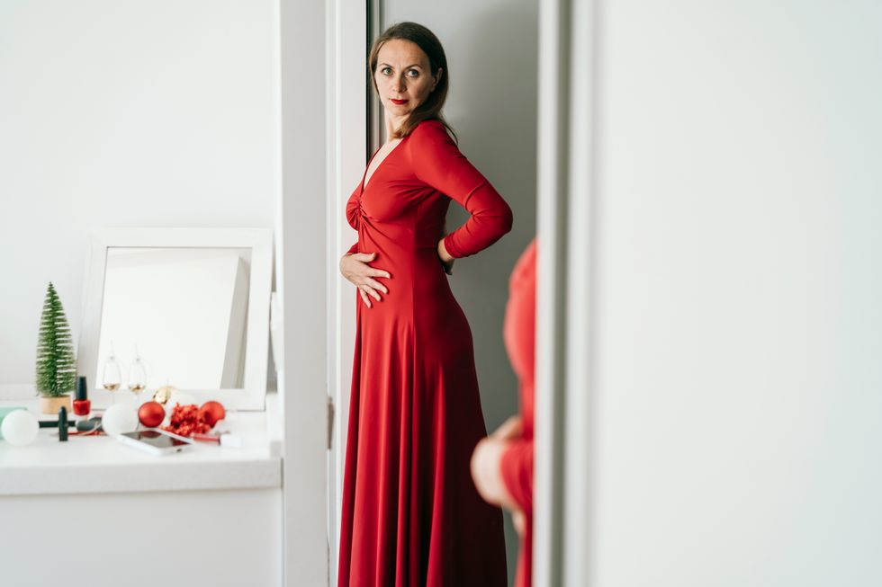 Woman trying on dress