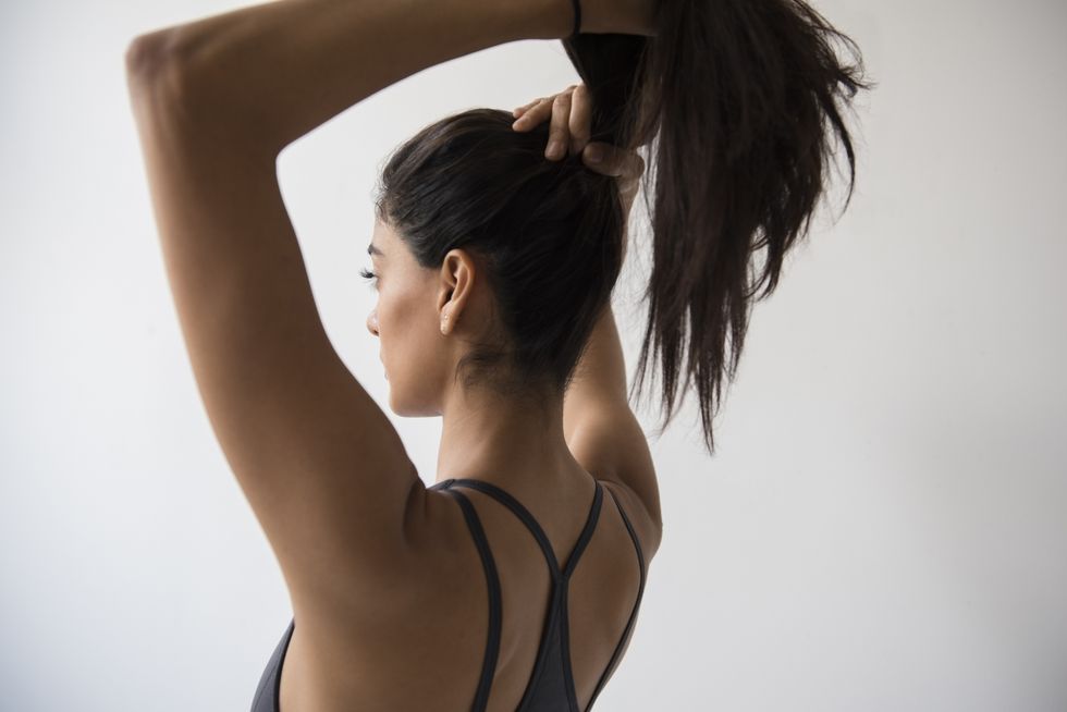 woman tying up hair