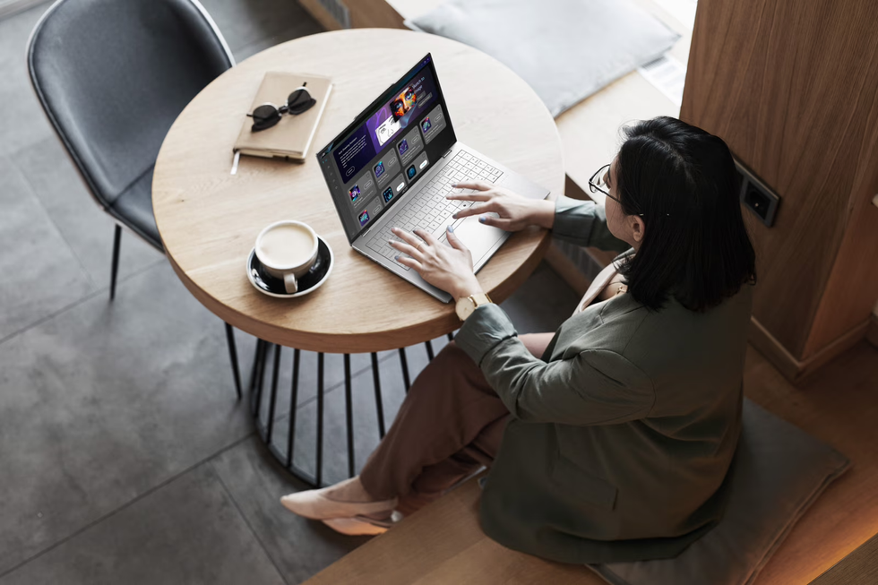 Woman typing on Acer Swift Air 16 laptop