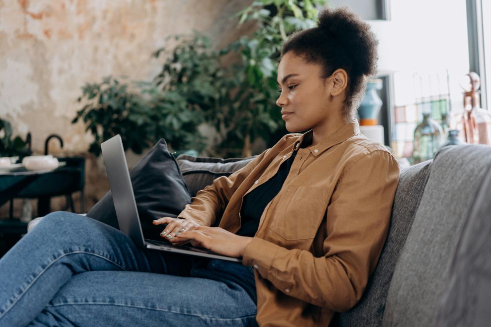 woman typing on laptop