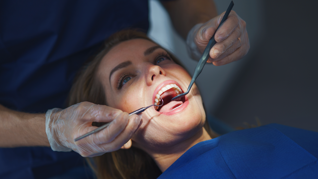 Woman undergoing dental surgery