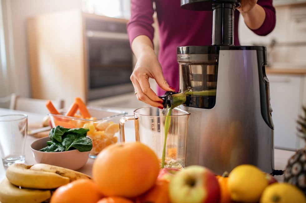 Woman using a juicer