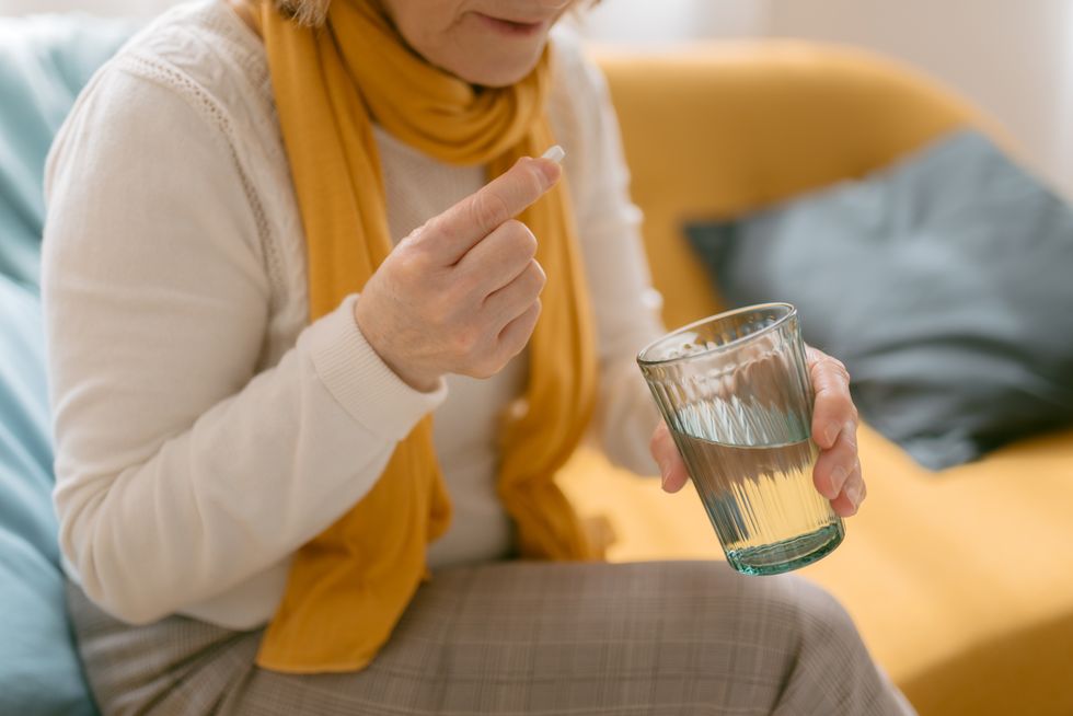 Woman using antibiotics