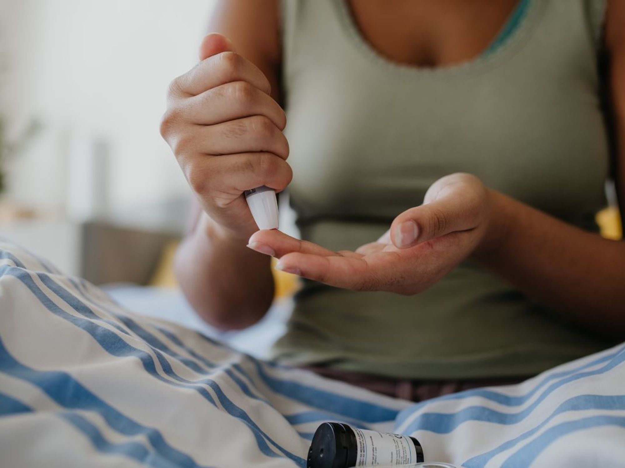 woman using blood monitor