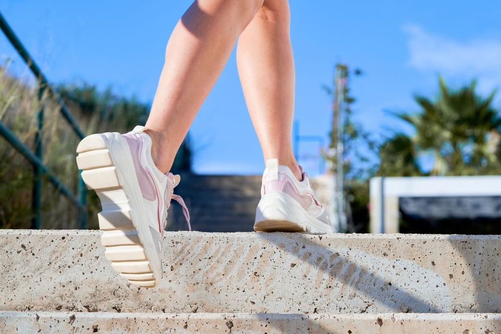 Woman walking up steps