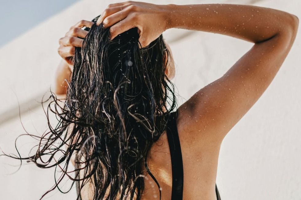 woman washing and rinsing hair
