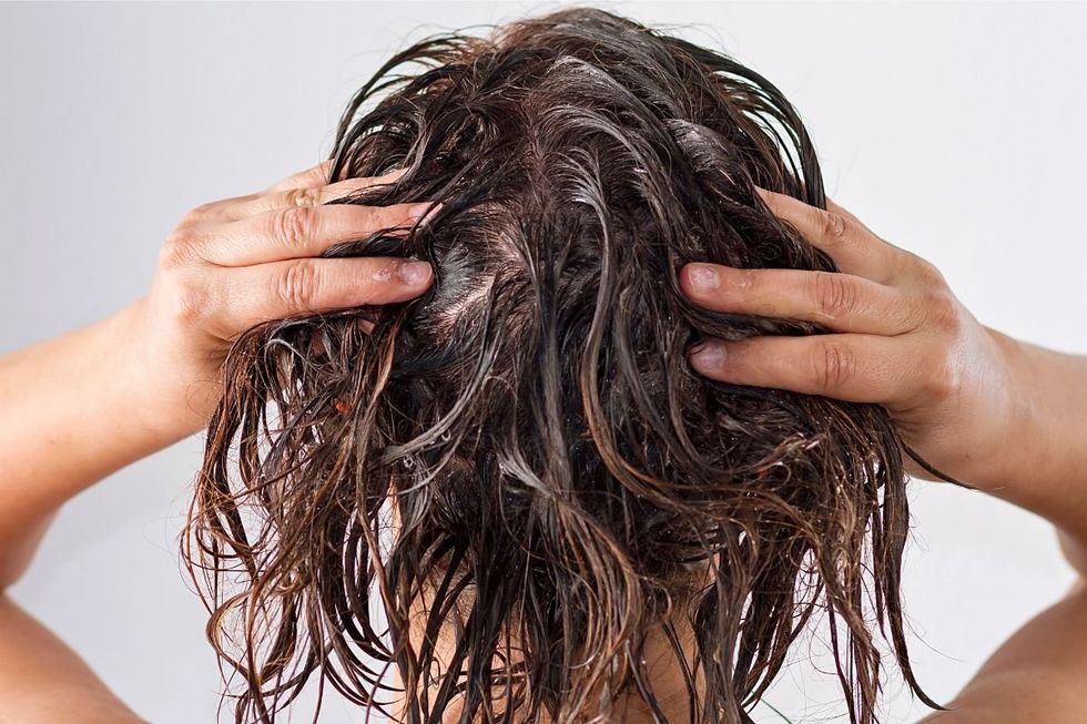 WOMAN WASHING HAIR