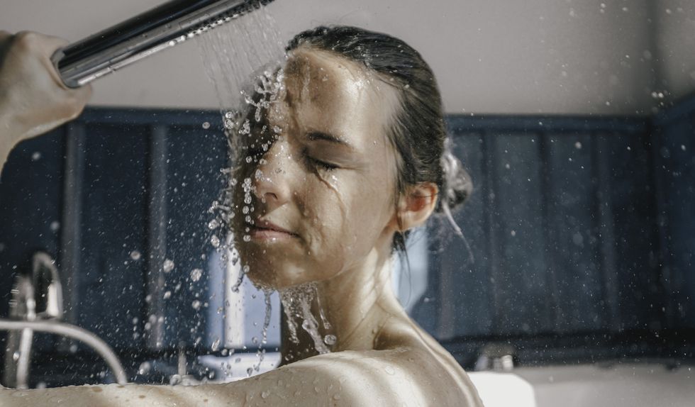Woman washing in shower