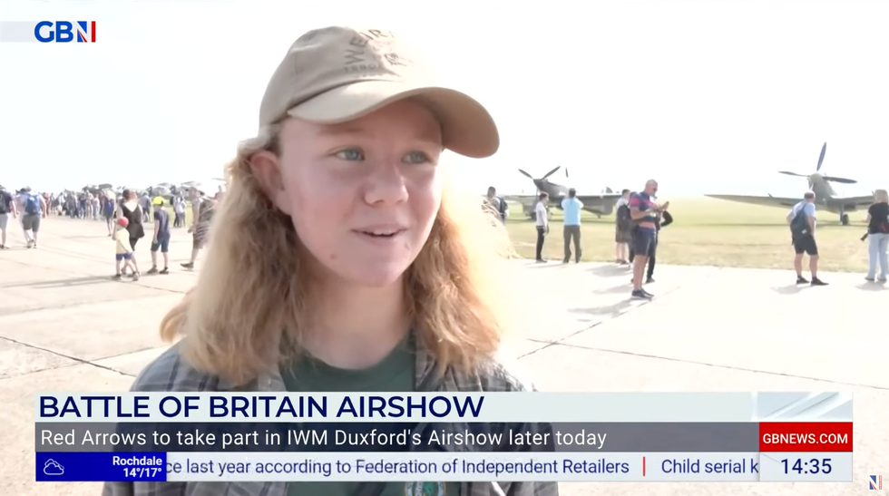 Woman watches Duxford airshow