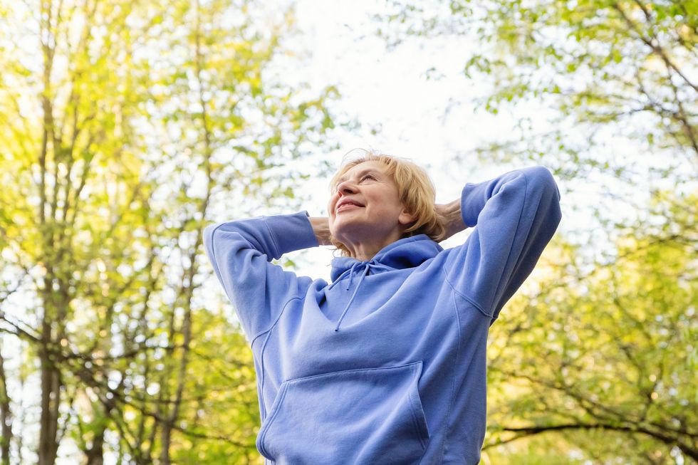 Woman wearing a hoodie outside