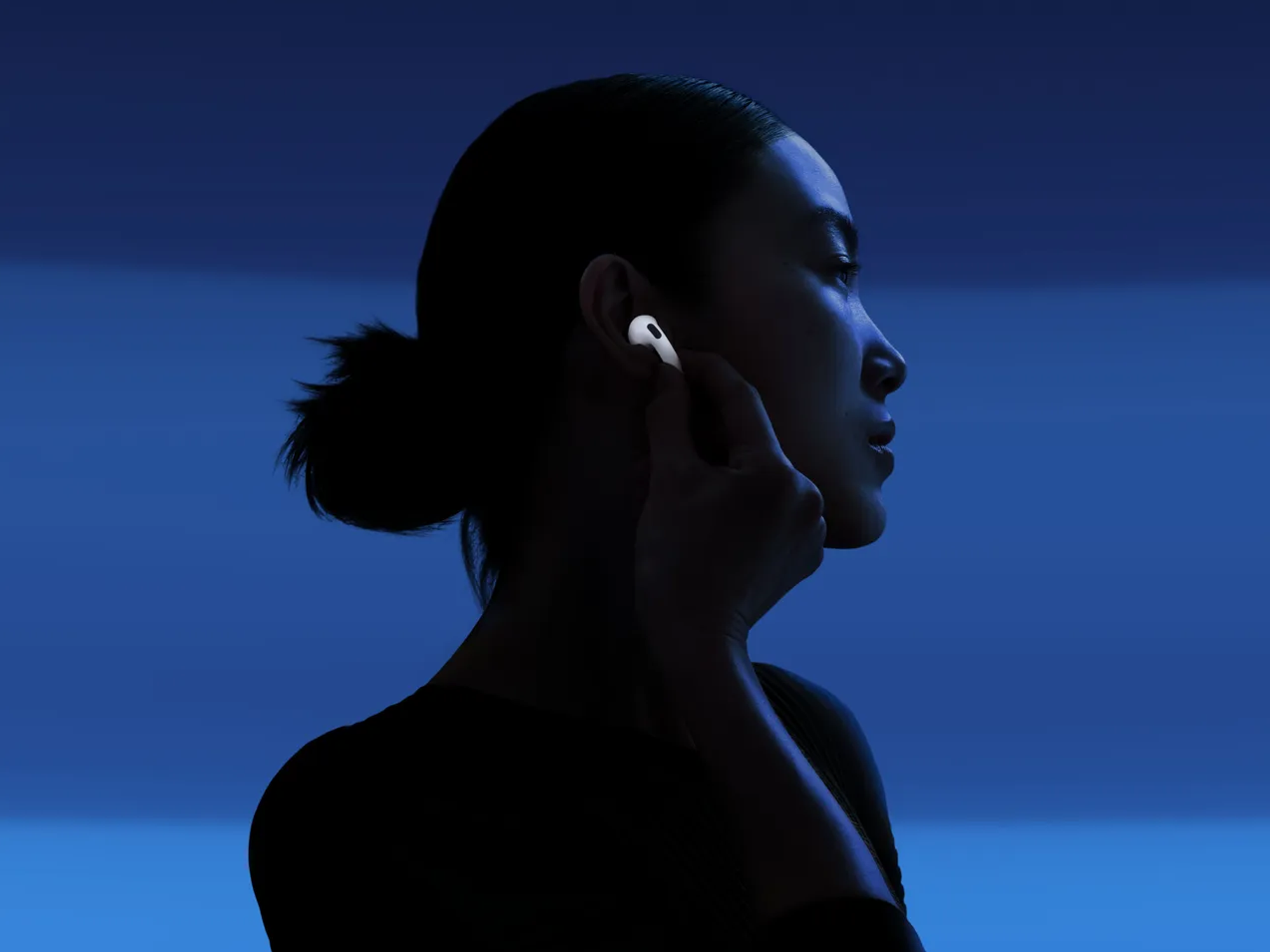 Woman wearing Airpods 4