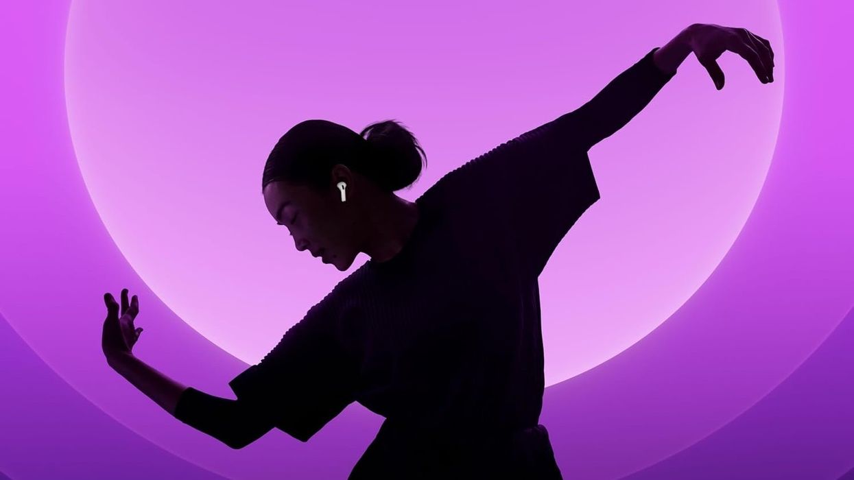 Woman wearing Apple AirPods 4