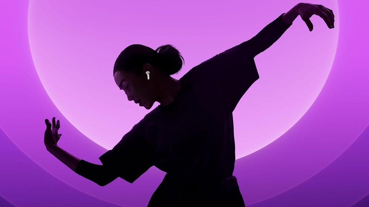 Woman wearing Apple AirPods 4