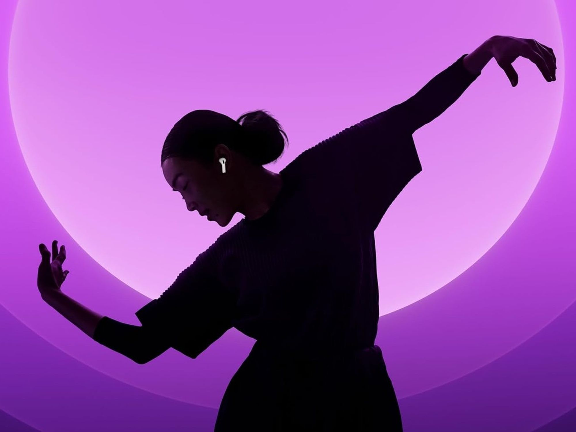 Woman wearing Apple AirPods 4