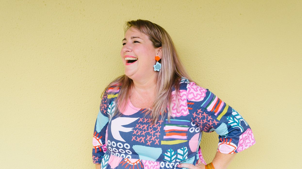 Woman wearing blouse with oversized prints