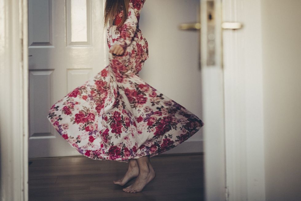 Woman wearing dress with large floral prints