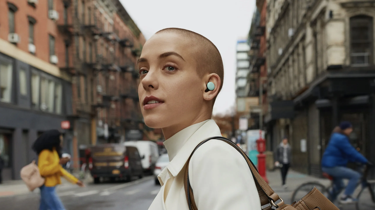 Woman wearing Google Pixel buds