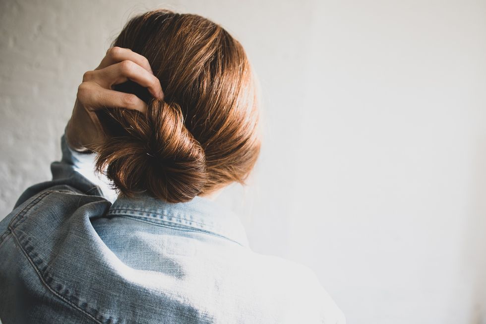 Woman wearing hair in low bun