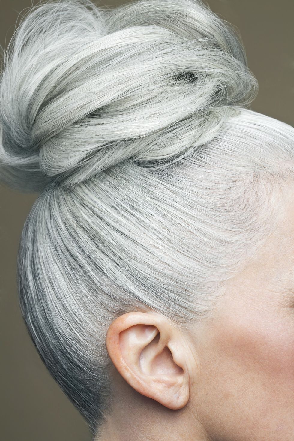 Woman wearing her grey hair in a bun