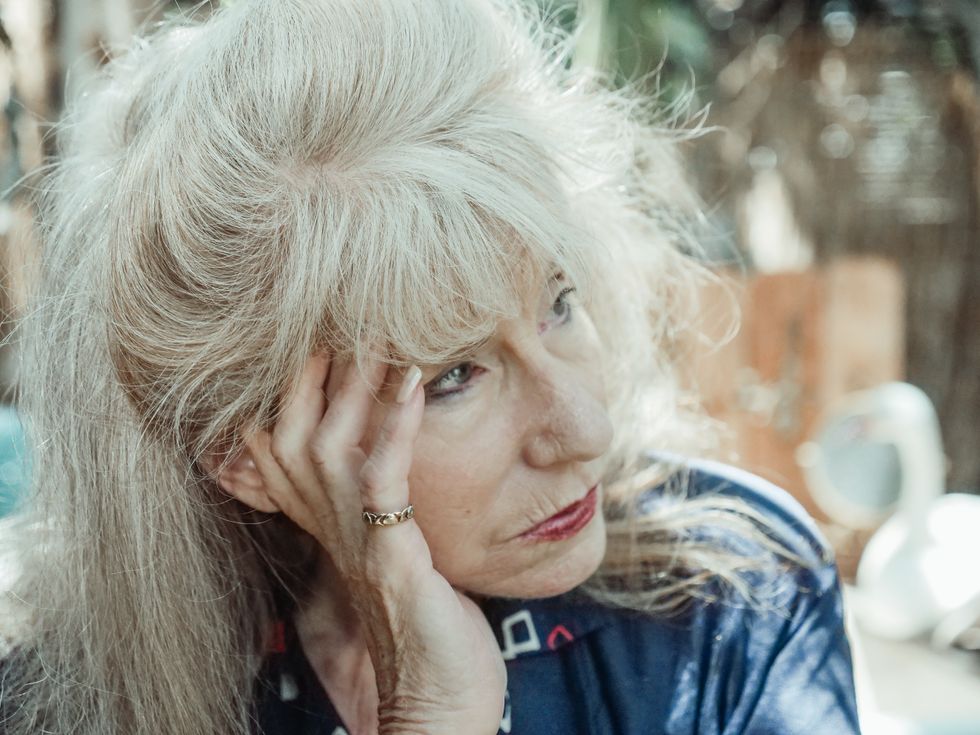 Woman with dementia staring solemnly into space