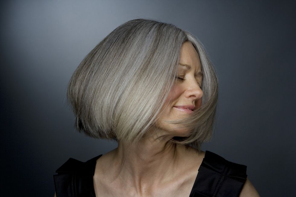 Woman with grey, voluminous hair