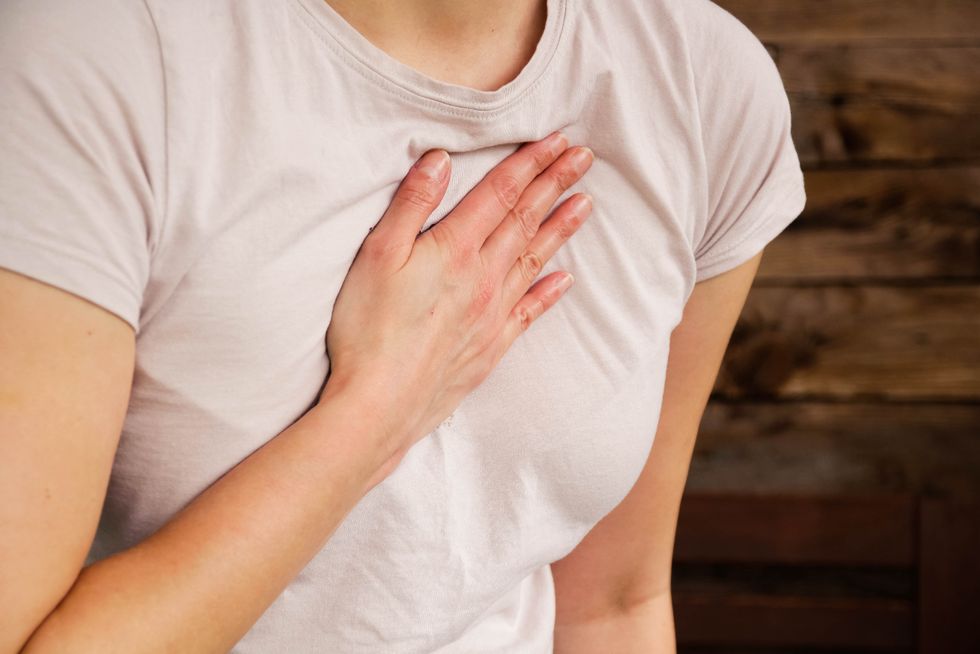 woman with hand over heart