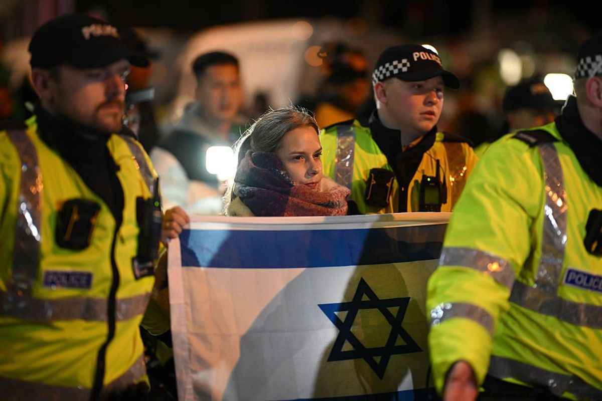 Woman with Israeli flag and police