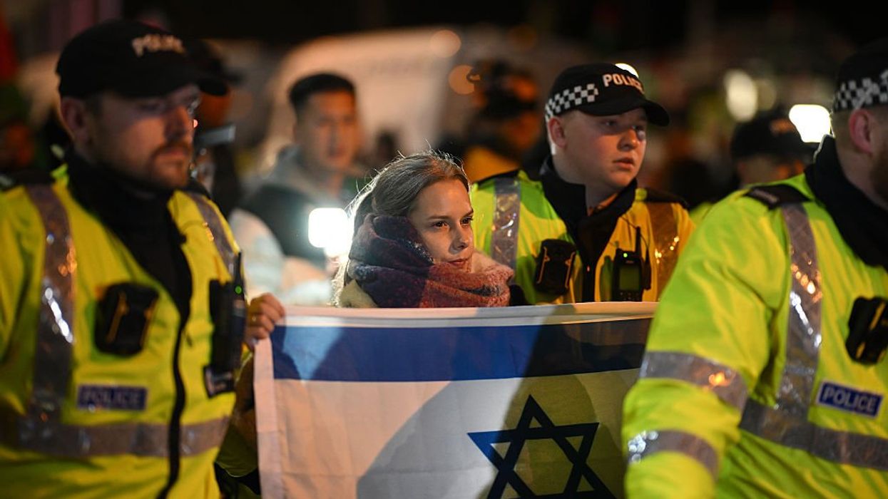 Woman with Israeli flag and police