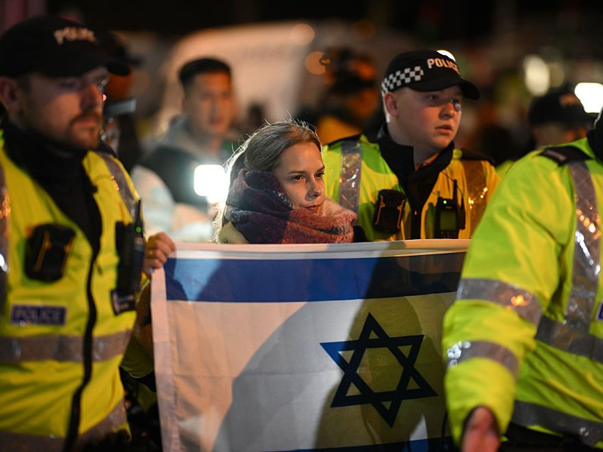 Woman with Israeli flag and police