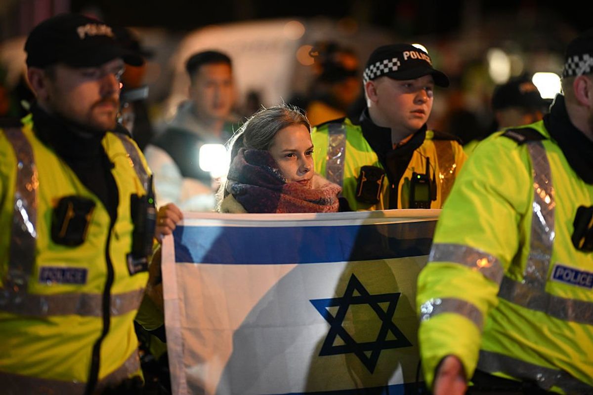 Woman with Israeli flag and police