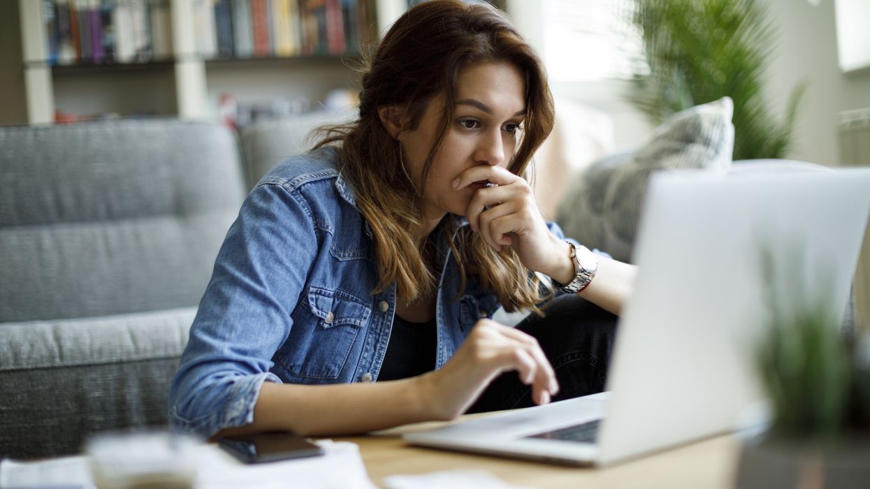 Woman worried at laptop