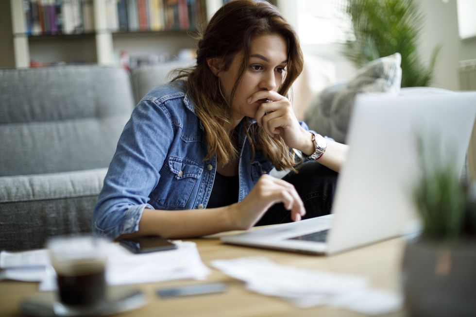 Woman worried at laptop