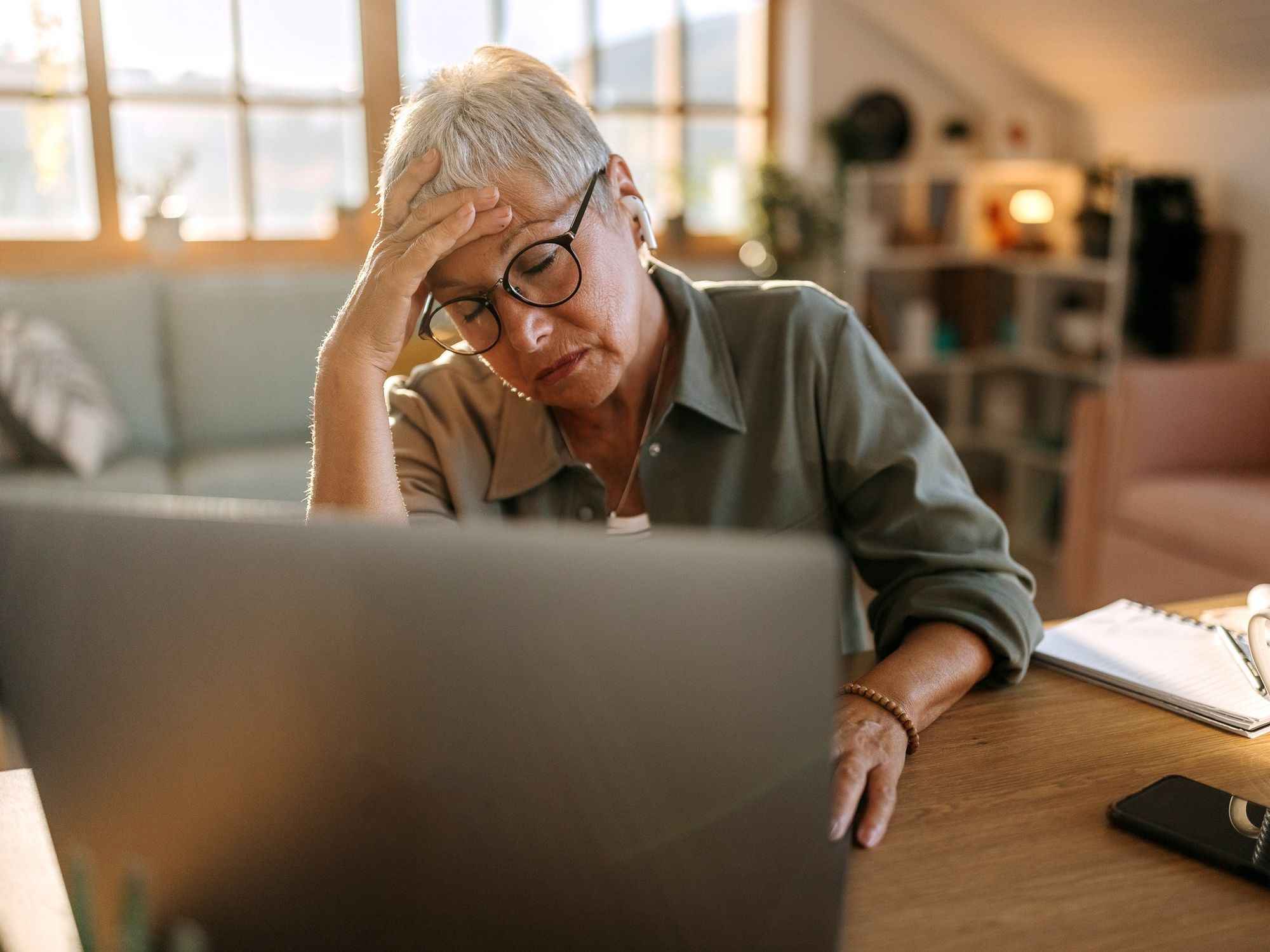 Woman worried at laptop