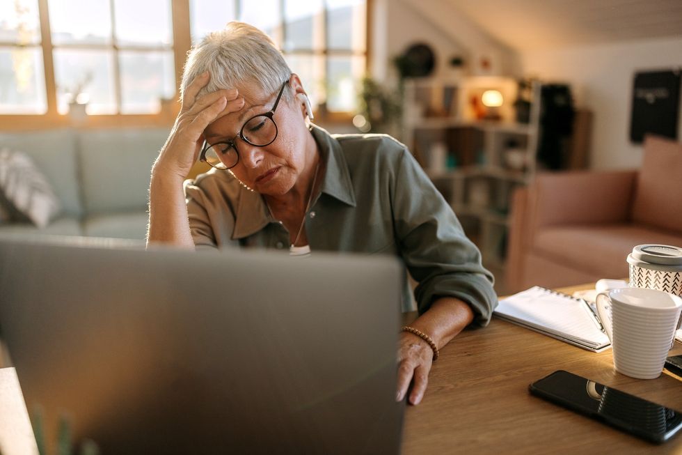 Woman worried at laptop