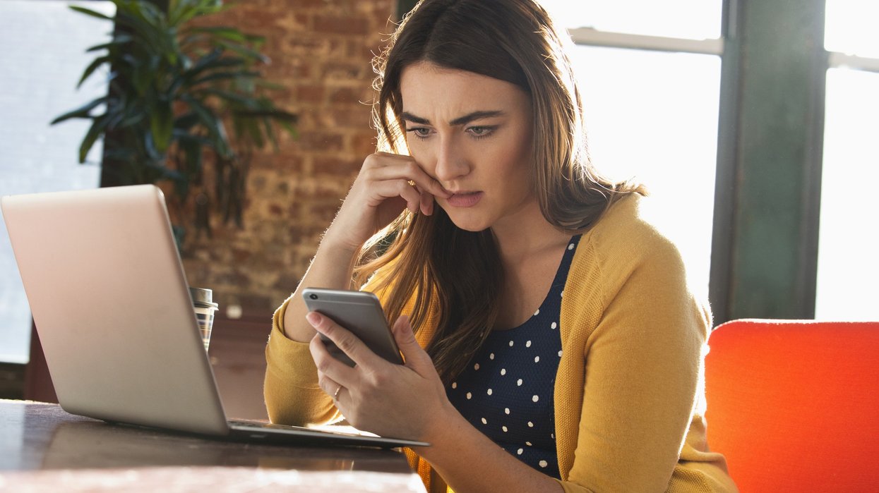Woman worried at phone