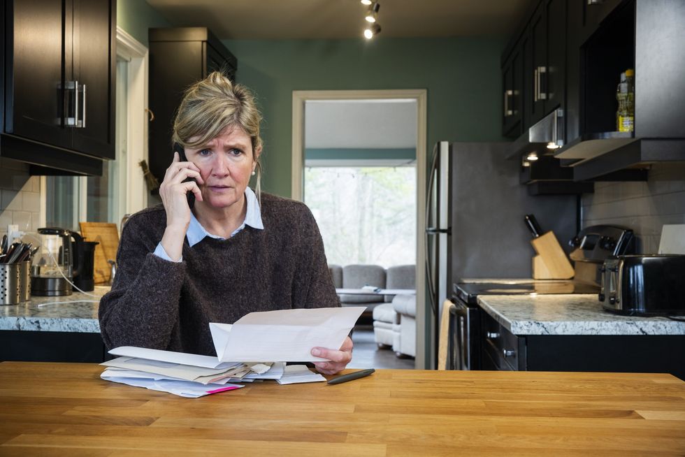 Woman worried while looking at finances