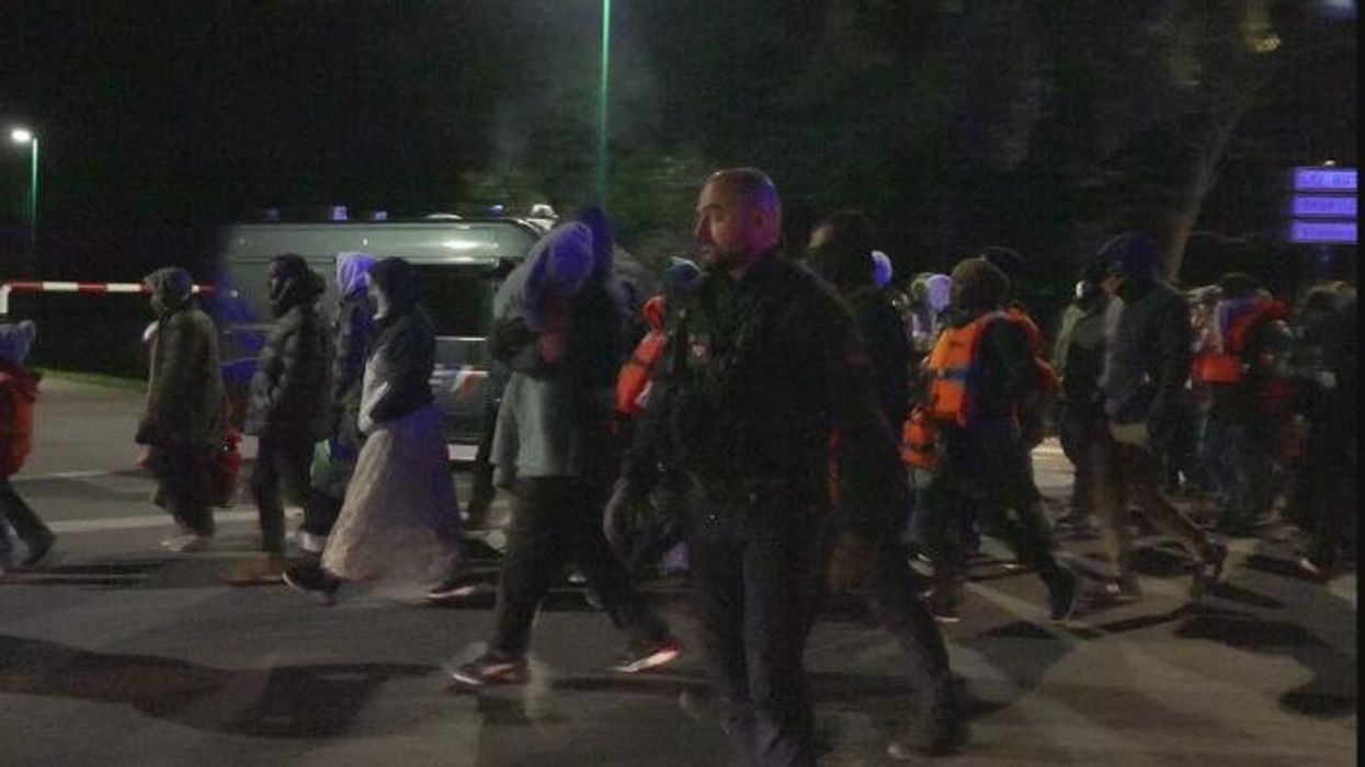 French riot police block dozens of migrants from reaching small boats in early hours confrontation