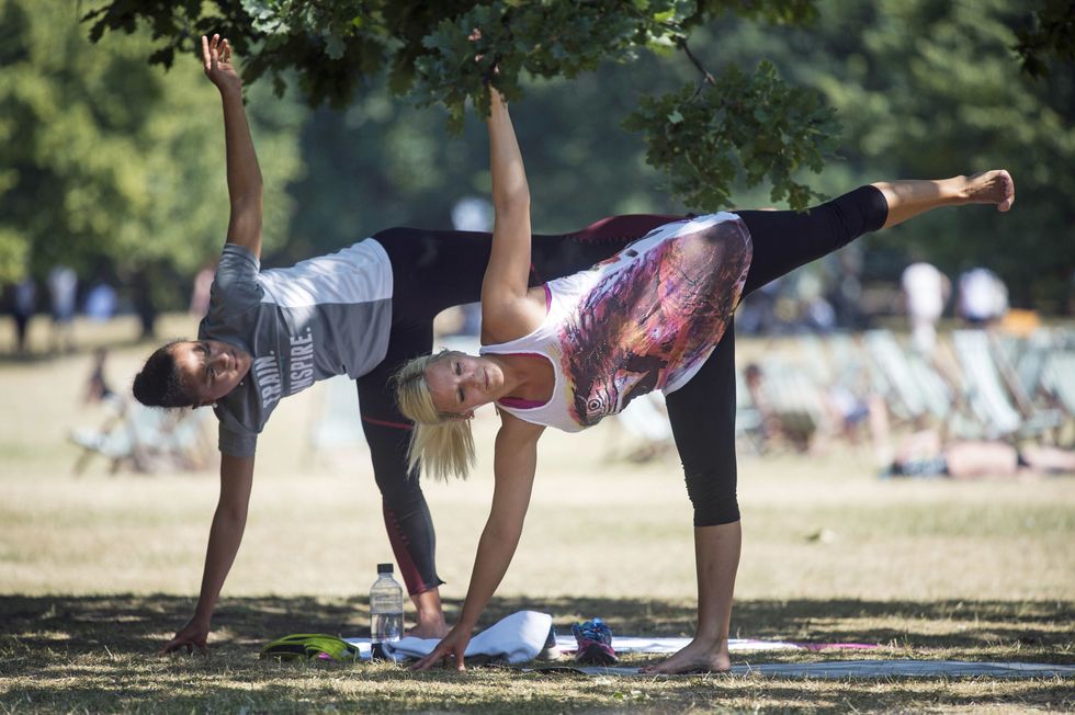 Women doing yoga in a park