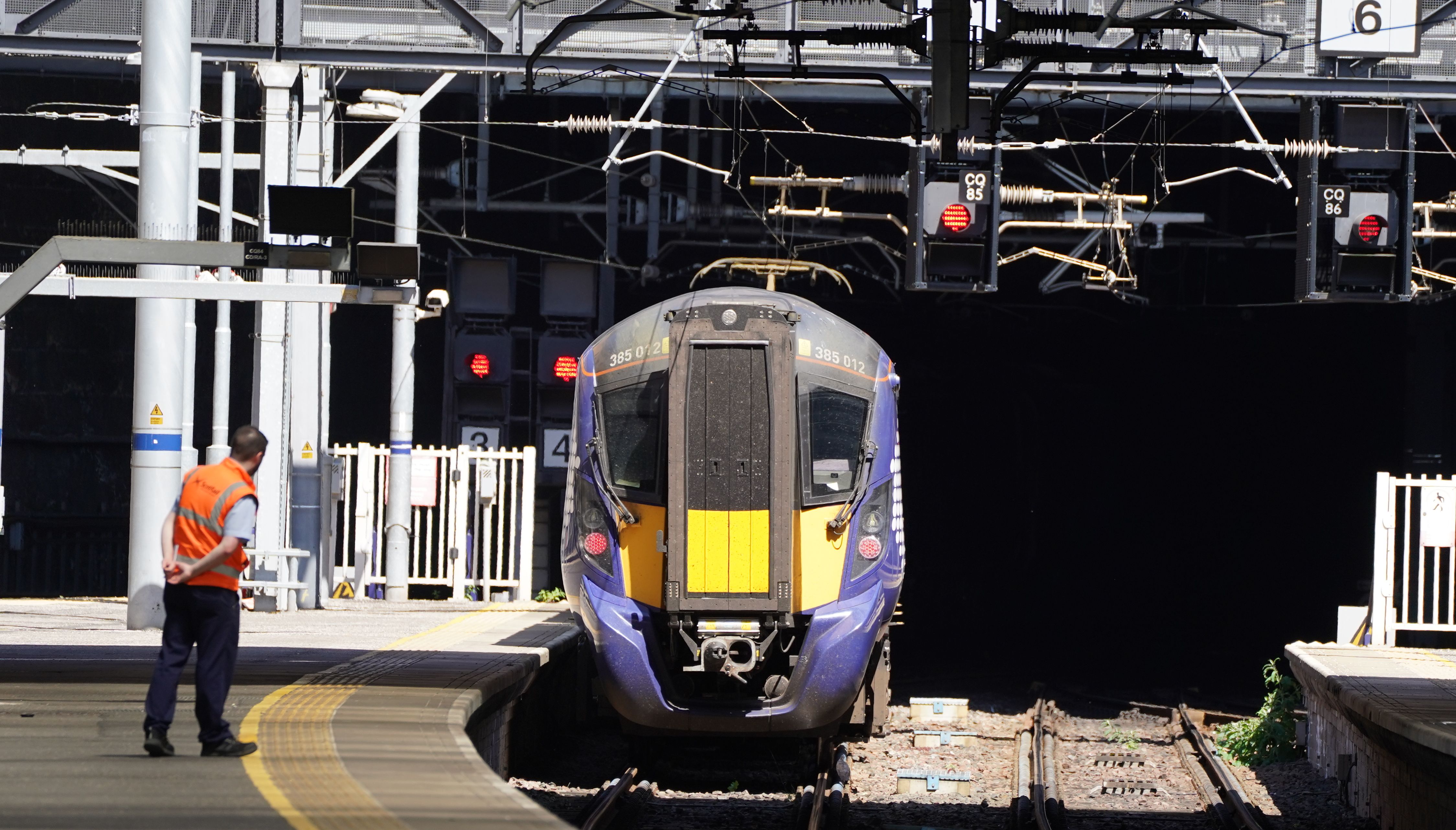 Workers at Glasgow Queen Street station. Trains will be disrupted due to industrial action as the RMT has announced industrial action on June 21, 23, and 25.