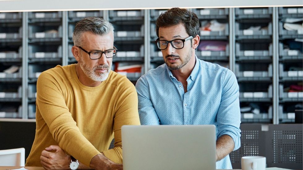 Workers at laptop
