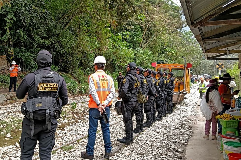 Workers block rail tracks at Machu Picchu