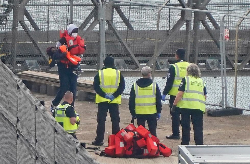 Workers prepare for arrival of migrants at Dover