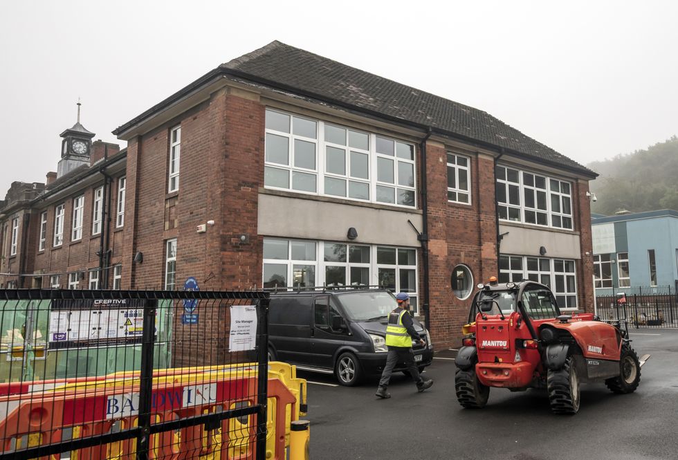 Workmen at Abbey Lane Primary School in Sheffield, which has been affected with sub standard reinforced autoclaved aerated concrete (Raac).