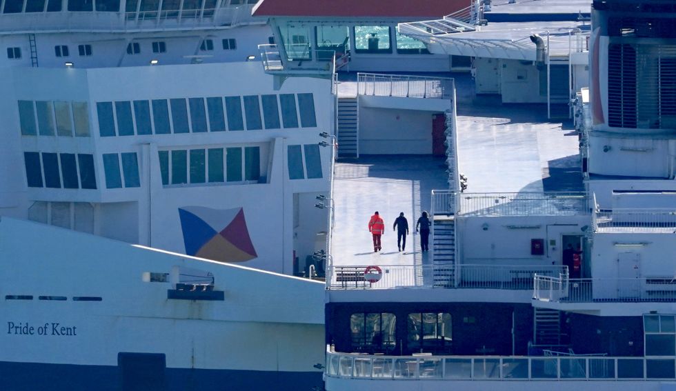 Workmen onboard the P&O Spirit of Britain at the Port of Dover after P&O Ferries suspended sailings and handed 800 seafarers immediate severance notices. Picture date: Friday March 18, 2022.