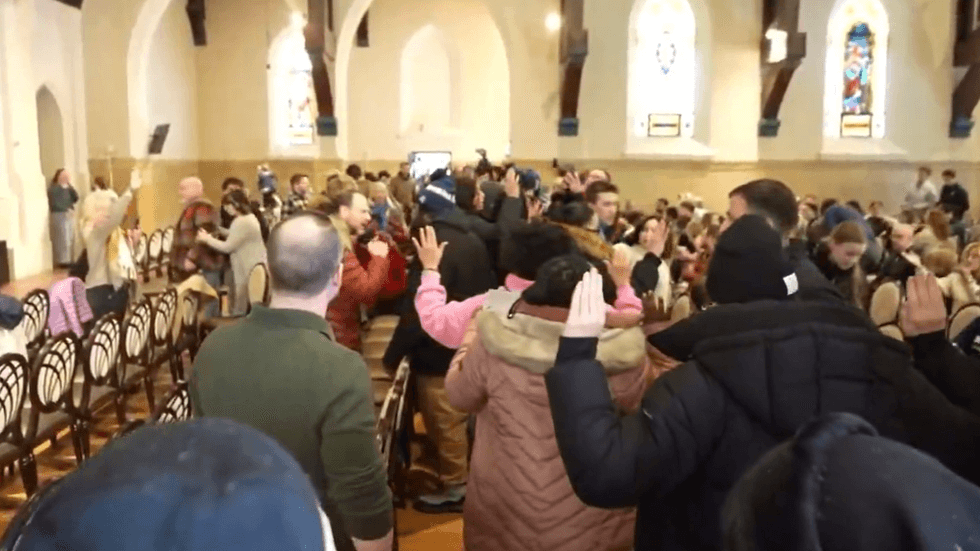 Worshippers confront activists