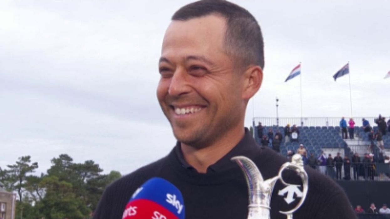 Xander Schauffele was all smiles as he held the Claret Jug